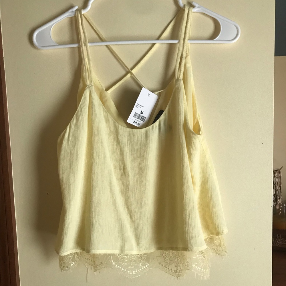 Yellow tank top w/ crisscross straps & lace detail